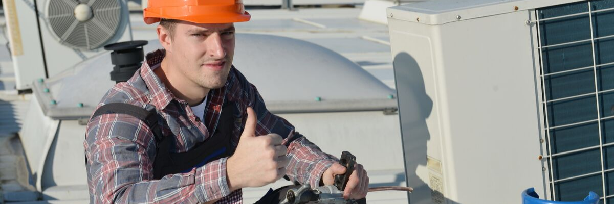 Technician giving thumbs up regarding HVAC job outlook